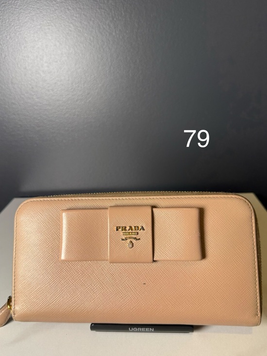 Prada Handbags - Prada Beige Leather Bow Zip-Around Wallet